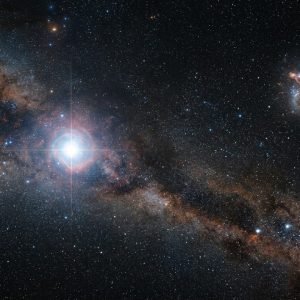 Representação artística da estrela primordial SDSSJ0715-7334 migrando da Grande Nuvem de Magalhães para a Via Láctea.