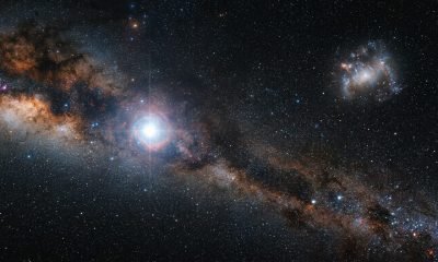 Representação artística da estrela primordial SDSSJ0715-7334 migrando da Grande Nuvem de Magalhães para a Via Láctea.