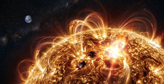 Regiões ativas do Sol em destaque, com campos magnéticos intensos e erupções solares visíveis, ilustrando a complexidade do clima espacial.